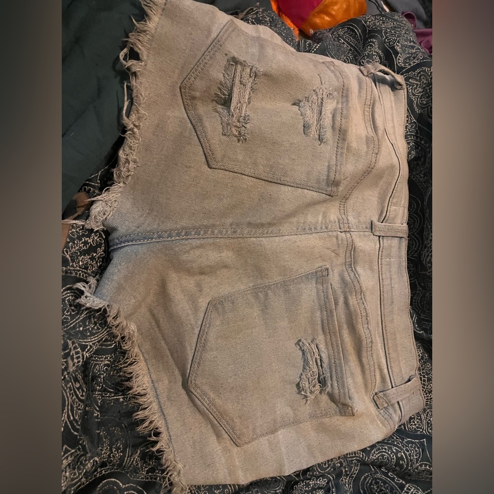 Light blue ripped shorts, high waisted and stretchy